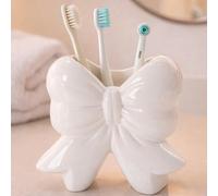 1/2 pièces Support de brosse à dents en forme d'nœud, porte-gobelet de brosse à dents de salle de bain mignon, convient pour la décoration et les accessoires de salle de bain, l'organisateur de vanité