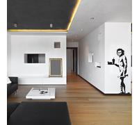 Autocollant mural Decords – scène humoristique représentant des hommes des cavernes, dimensions : 112 x 221 cm