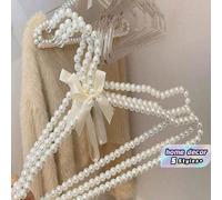 Cintres de vêtements en plastique avec nœud et perles fausses pour robe de mariée, pantalon, veste. Rangement et organisation de la penderie, décoration de la maison. Cintres de luxe de couleur blanc 