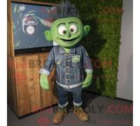 Costume de mascotte REDBROKOLY Guinness vert forêt habillé d une chemise en jean et de montres numériques