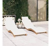 Ensemble de deux transats en bois massif d'acacia, pliables, avec coussins crème. Transat de jardin ergonomique, idéal pour la terrasse ou la plage. Dimensions : 175 x 50 x 55 cm