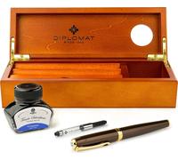Ensemble stylo plume Diplomat Excellence A2 Marrakesh Gold avec une cartouche d'encre pour stylo plume bleu roi, présenté dans un coffret en bois précieux de grande qualité, avec des éléments en acier