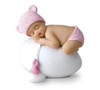Figurine bébé rose dormant sur un œuf, 7,5 x 8 cm.