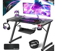 KESSER® Table de Jeu - 120 x 60 cm - Bureau Gamer en Forme de Z - Crochet pour Casque et revêtement en Carbone - Bureau d'ordinateur Ergonomique - Table Stable avec Porte-gobelet - Noir
