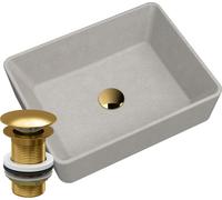 Lavabo avec plan de travail en granit beige et bouchon doré