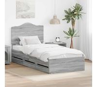 Le sommier à lattes moderne en bois gris sonoma 100x200 cm avec tiroirs cachés et lattes rigides offre un support solide pour le matelas.