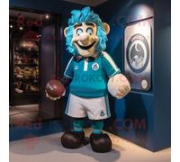 Personnage De Costume De Mascotte Redbrokoly Cyan Guinness Habillé D'un Maillot De Rugby Et De Ceintures De Smoking Multicolore