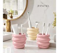 Tasse de rangement en résine à 4 couches en spirale style crème très populaire, support bicolore rose brillant et beige pour brosse à dents, dentifrice, rasoir et pinceau de maquillage, décoration est